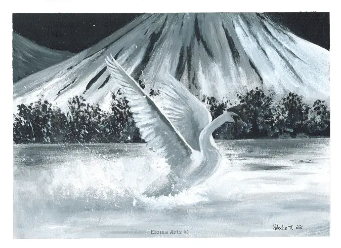 Swan landing on the water of the lake, with mountains on the background